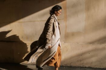 lady walking in smart neutral clothing