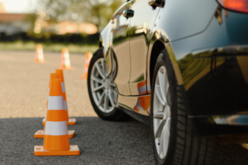 car next to set up traffic cones