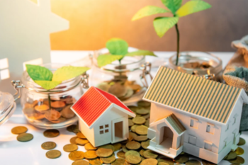 toy houses next to coins