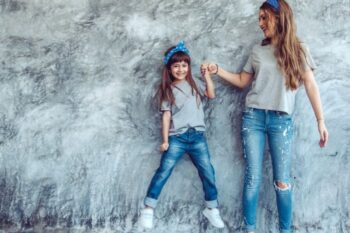 mum and girl wearing jeans and grey tshirts