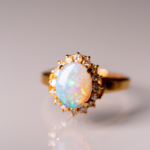 gold ring with diamonds and pearlescent centre