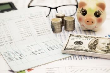 bank account papers, cash and piggu back