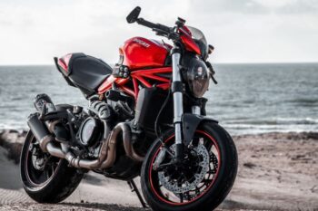 red motorbike with sea in background