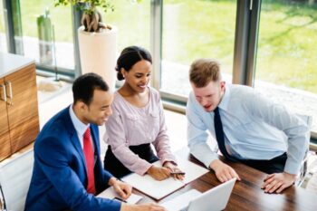 business people looking at laptop