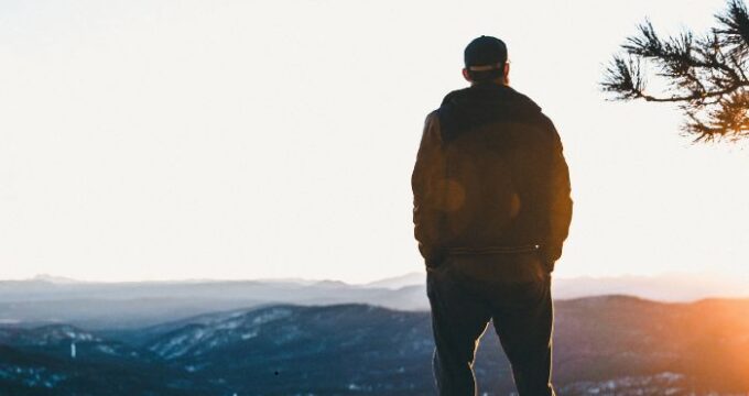 Nature lover enjoying sunset views in the mountains.