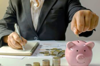 Coins savings with piggy bank for financial planning and money management in business or personal finance context.
