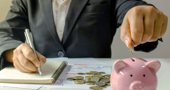 Coins savings with piggy bank for financial planning and money management in business or personal finance context.