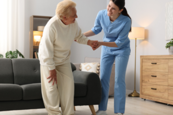 home care worker helping elderly lady