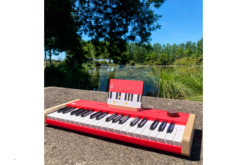 loog piano with lake behind