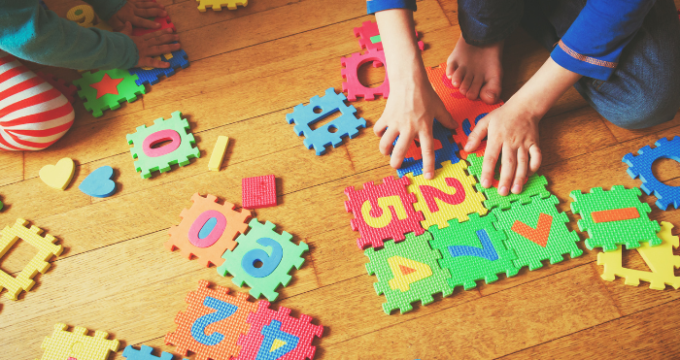 child playing with number and bright jigsaws