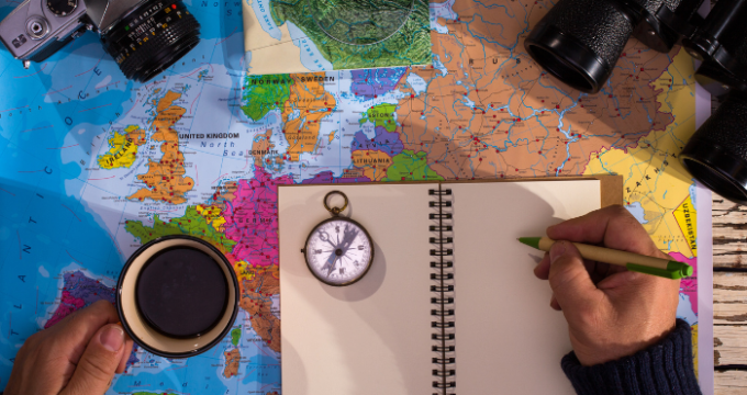 map, notebook, compass, camera
